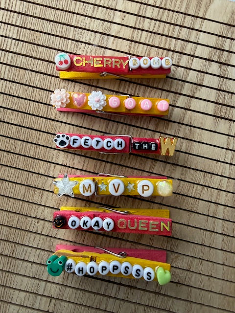 Volleyball - yellow and pink Cherry Bomb, GOAT, Fetch the W, MVP, Okay Queen, and Hoppsss