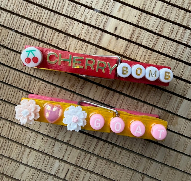 Volleyball - yellow and pink Cherry Bomb, GOAT, Fetch the W, MVP, Okay Queen, and Hoppsss